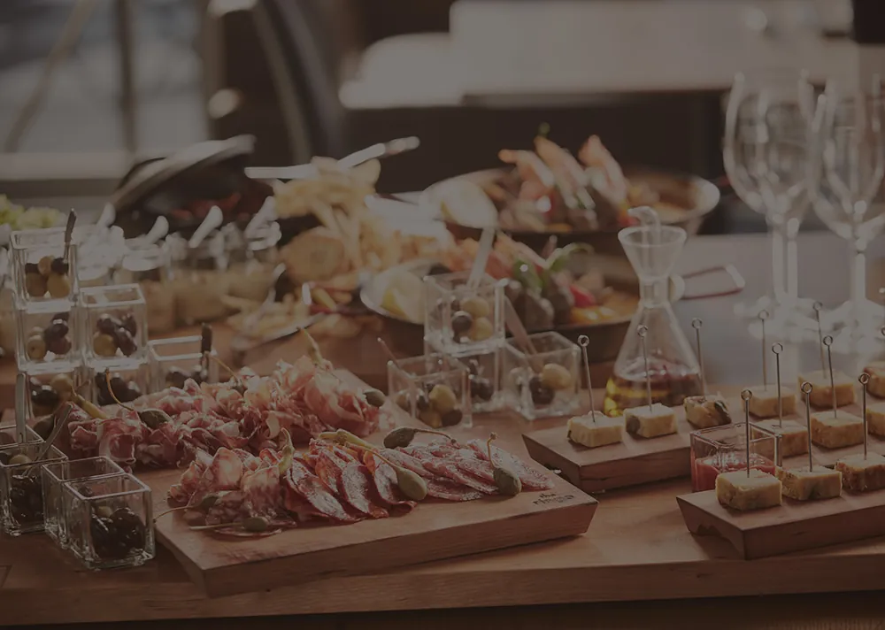 Standing-party table with glasses and dishes