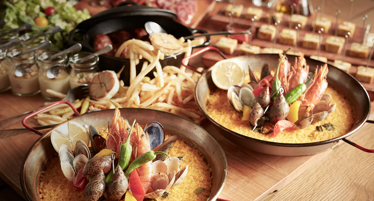 Paella and potatoes served at EX
