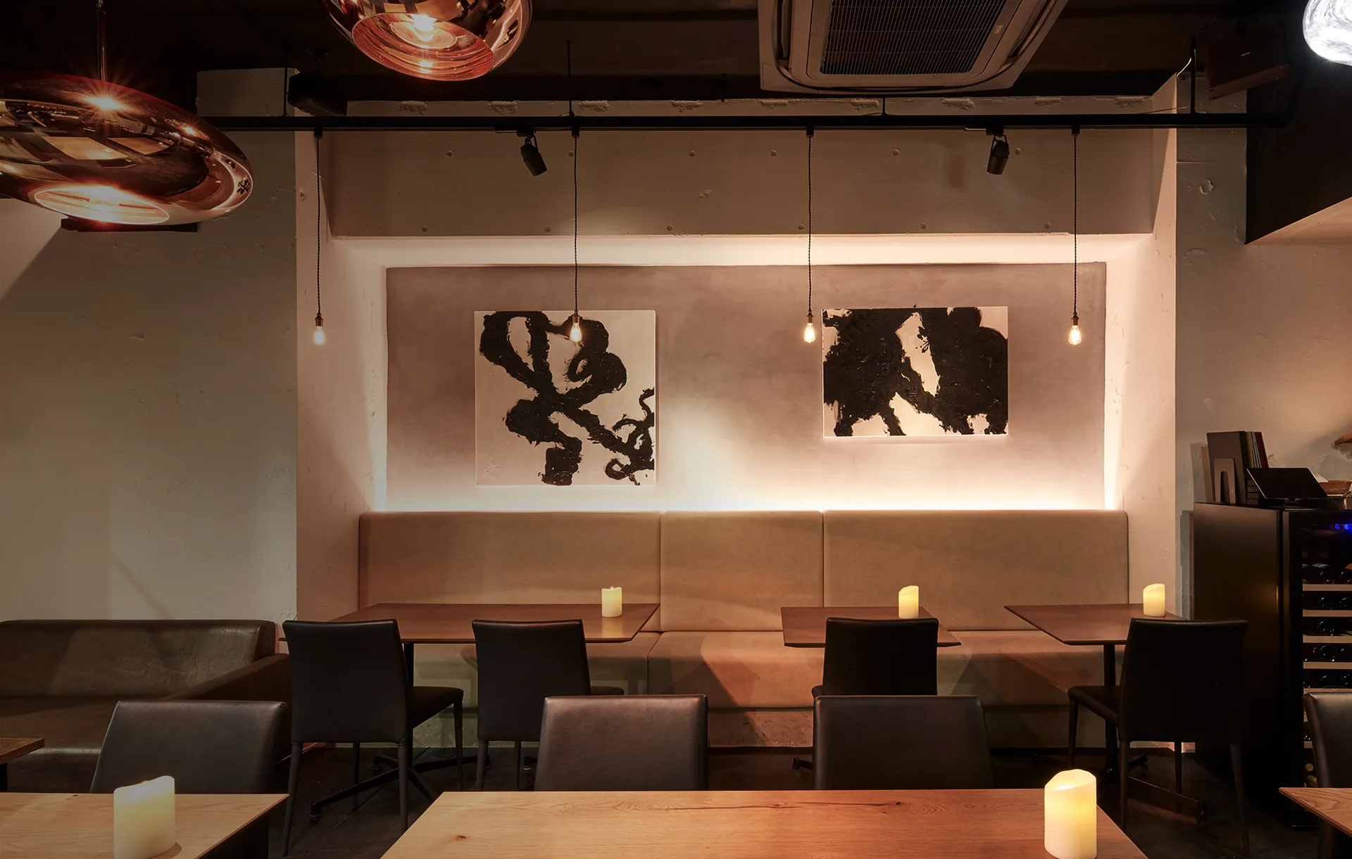 EX dining room with black ink art on the wall