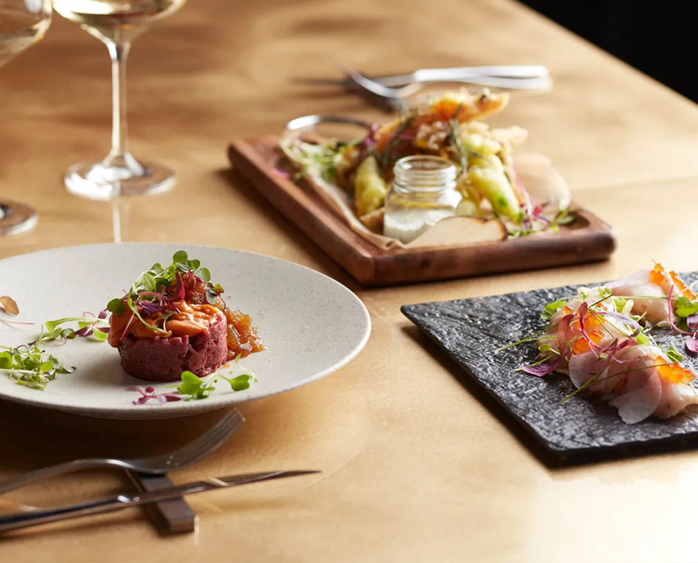 EX dishes arranged on a wooden table